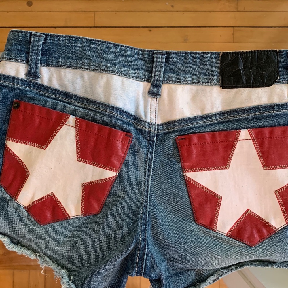 SOLD.   Cute leather star patch shorts